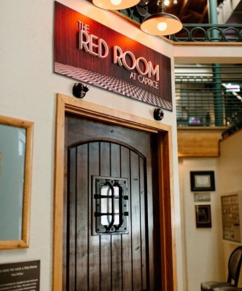The arched wooden door to the Red Room